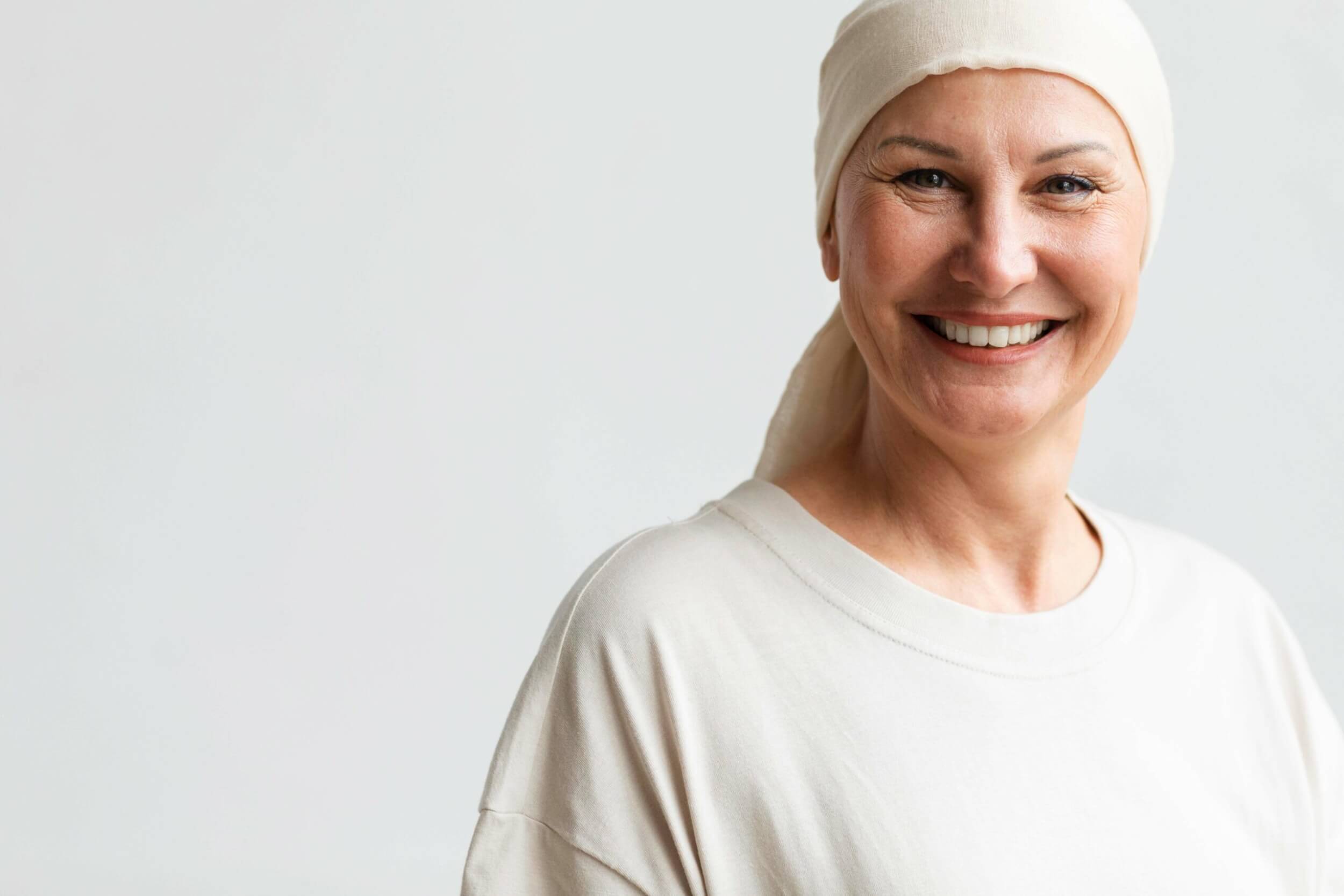 middle-aged-woman-smiling-with-cloth-wrapped-over-head