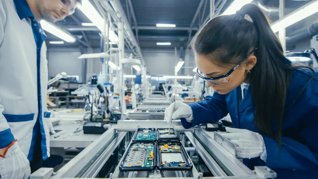 Woman engineer on production line